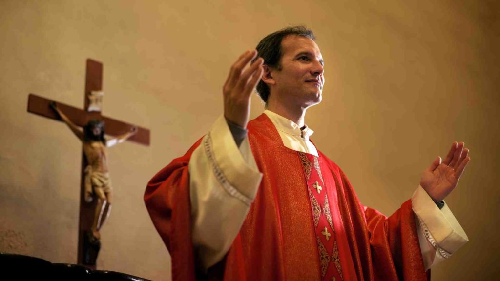 Photograph of a christian priest talking about abstinence (a form of semen retention).