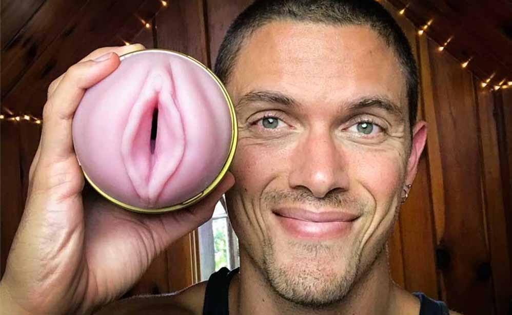 Man Taylor Johnson holding Stamina Training unit fleshlight smiling happy satisfied