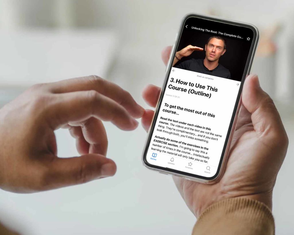 Man holding a cell phone with taylor johnson's online course on screen
