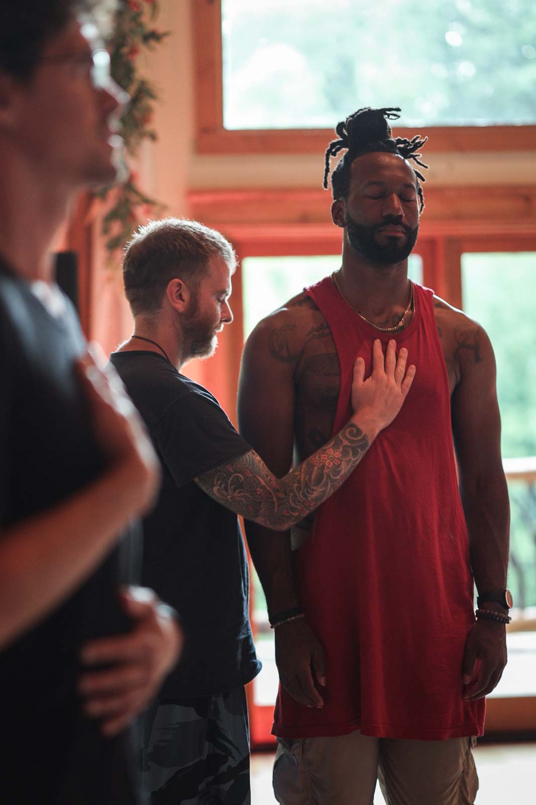 Photo of two men in an awareness practice led by Taylor Johnson at the 2026 sexual leadership retreat.